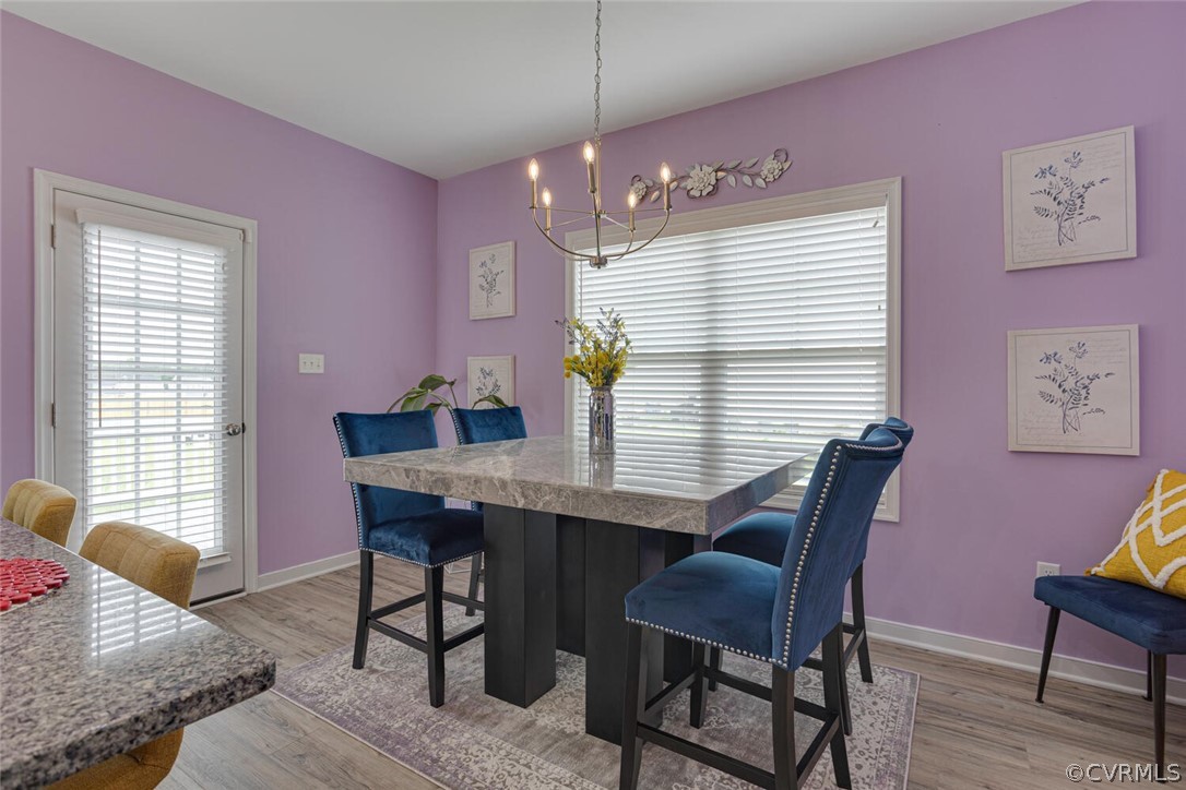 4948 Michaelwood Road Chesterfield, VA 23832 - Photo 15 of 38 Dining room featuring a chandelier and light hardw