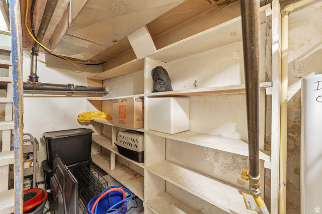210 North 200 West Logan, UT 84321 - Photo 31 of 31 Built-in shelving units offer storage solutions in this utility space