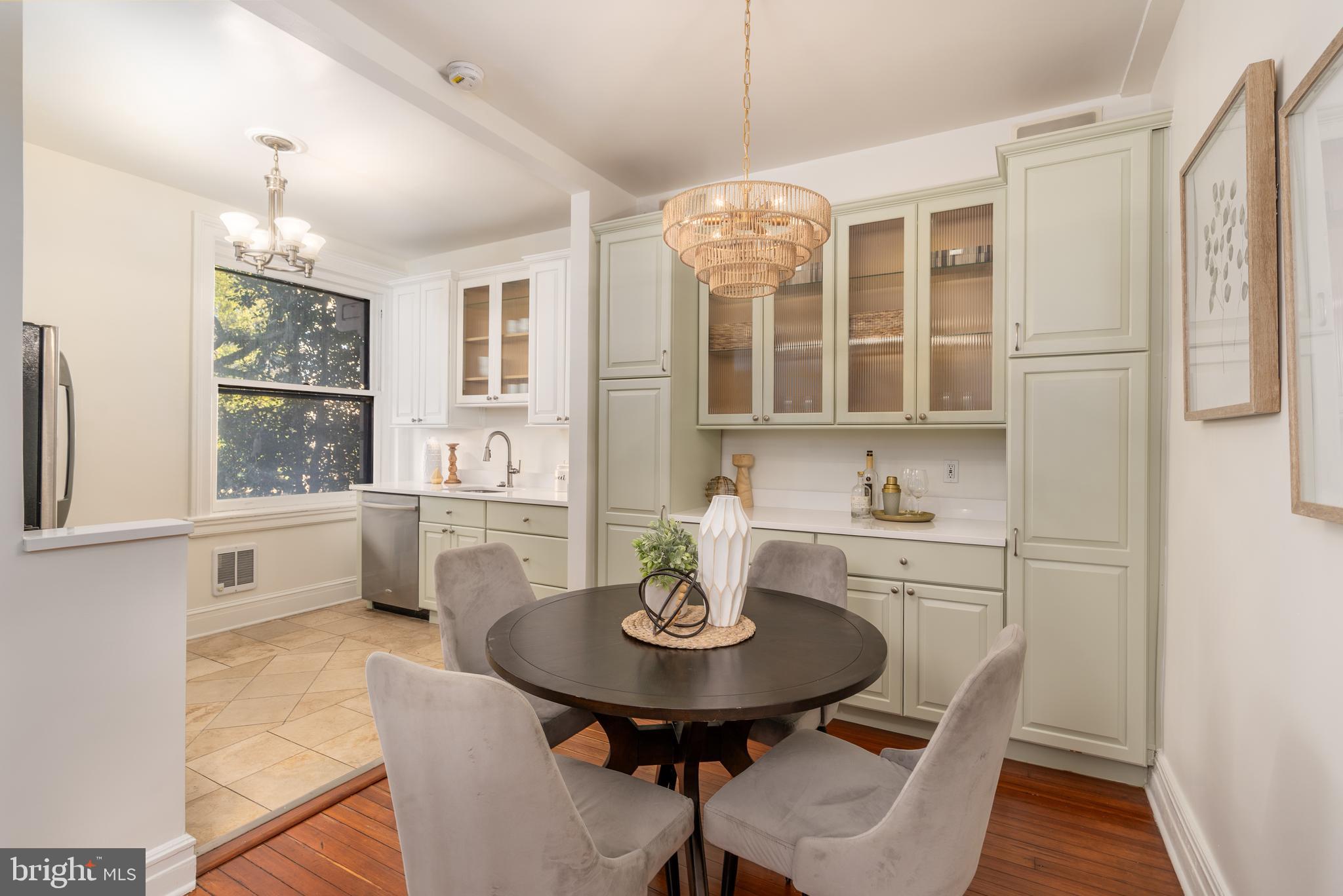 3060 16th Street Northwest, Unit 209 Washington, DC 20009 - Photo 11 of 33 a view of a dining room with furniture window and wooden floor