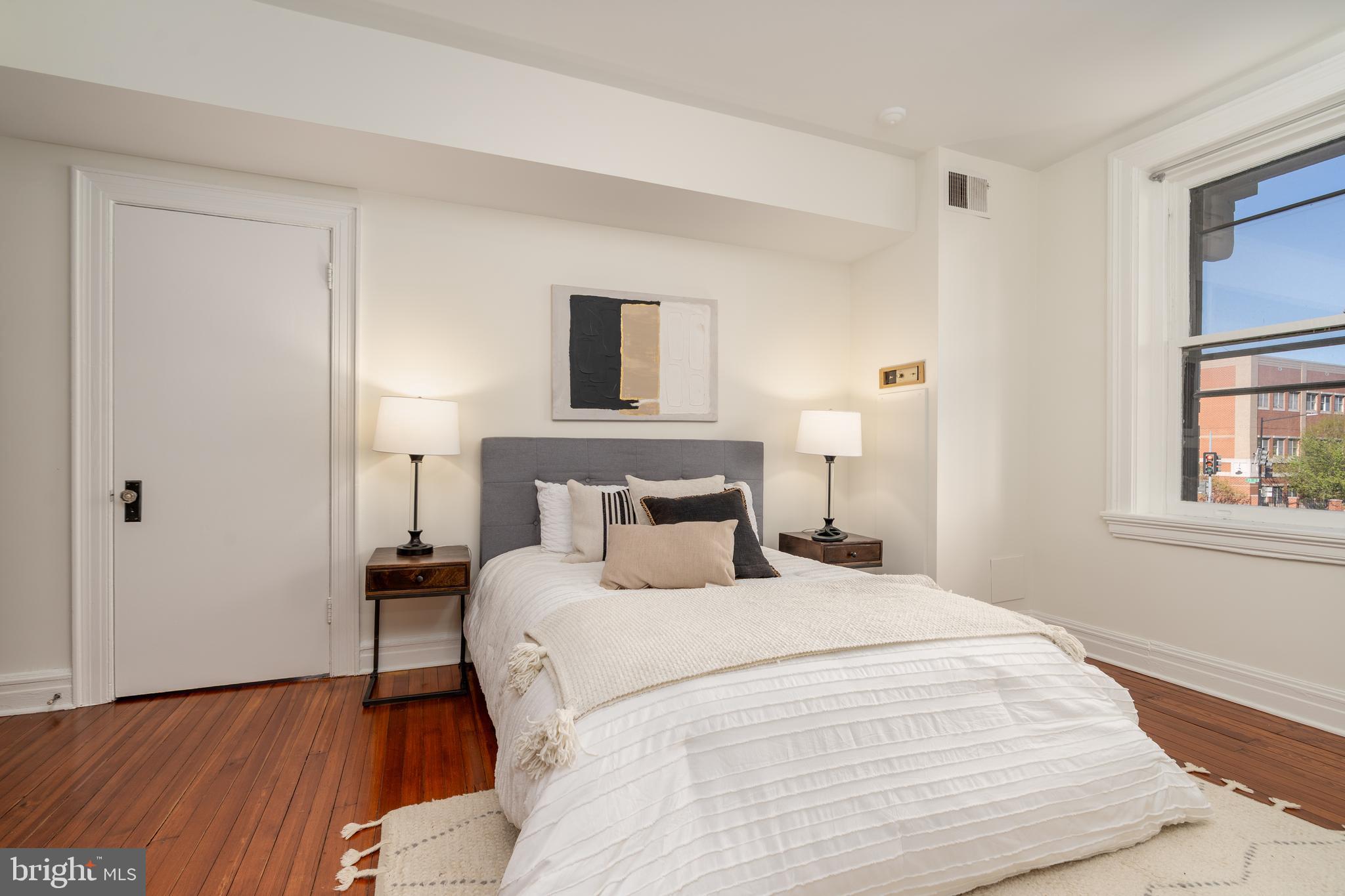 3060 16th Street Northwest, Unit 209 Washington, DC 20009 - Photo 17 of 33 a bedroom with a bed and a window