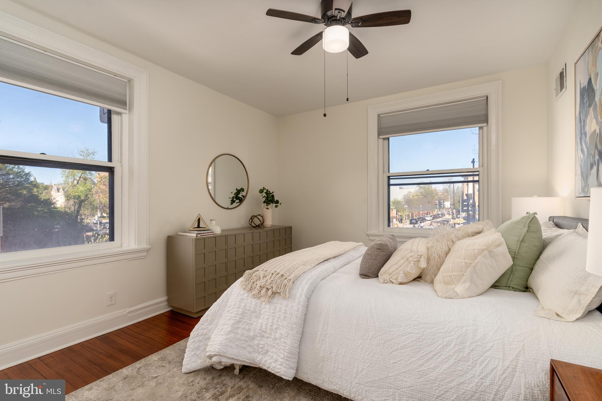3060 16th Street Northwest, Unit 209 Washington, DC 20009 - Photo 20 of 33 a bedroom with a bed and a window