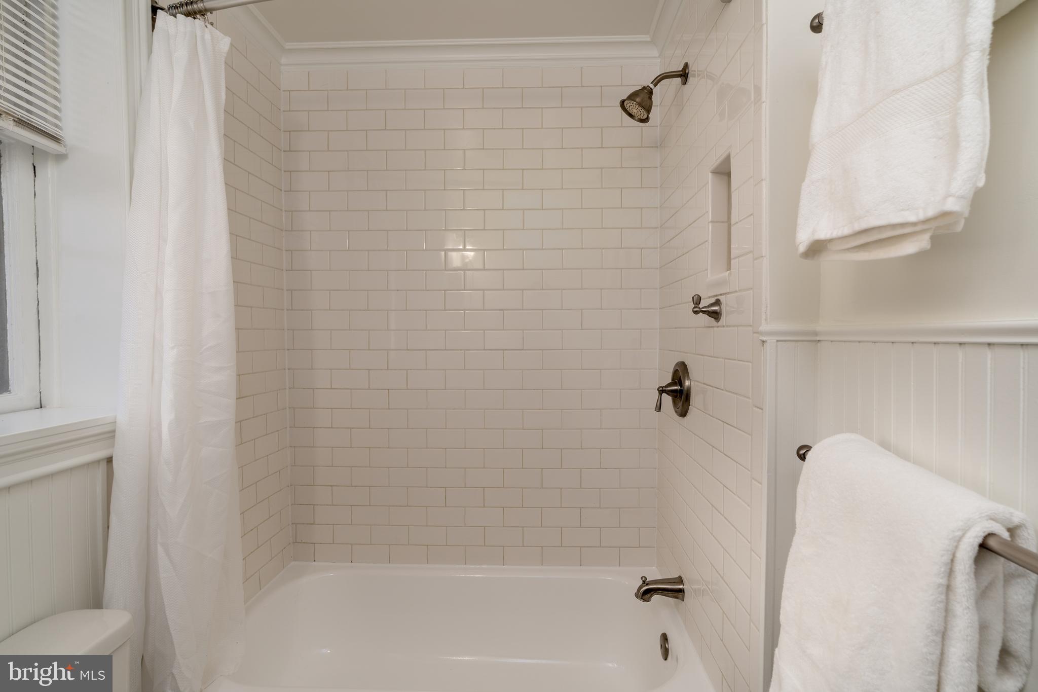 3060 16th Street Northwest, Unit 209 Washington, DC 20009 - Photo 23 of 33 a bathroom with a shower