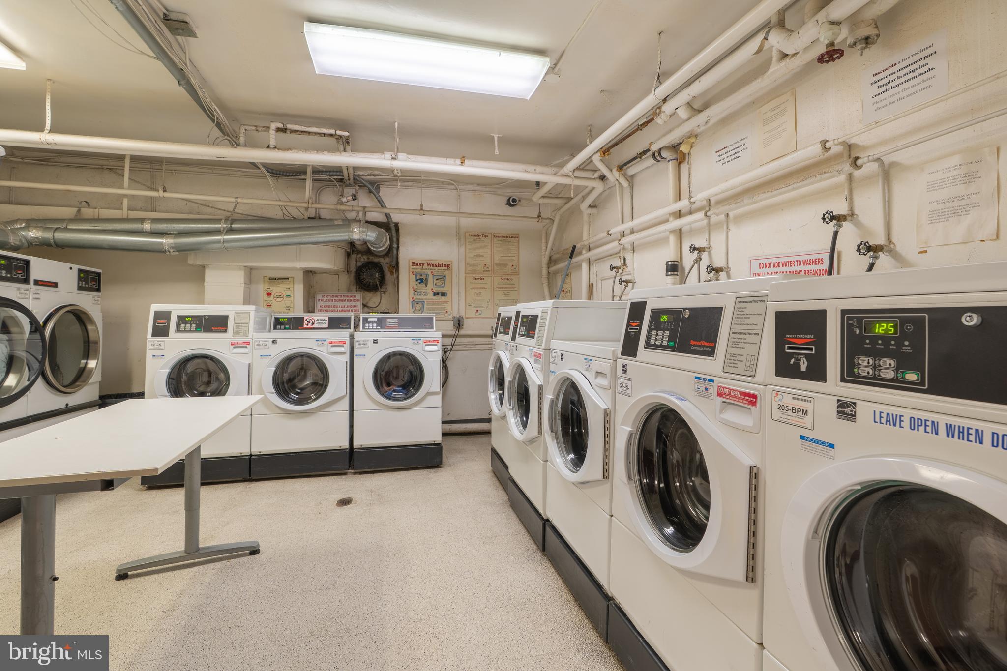 3060 16th Street Northwest, Unit 209 Washington, DC 20009 - Photo 24 of 33 a utility room with dryer and washer