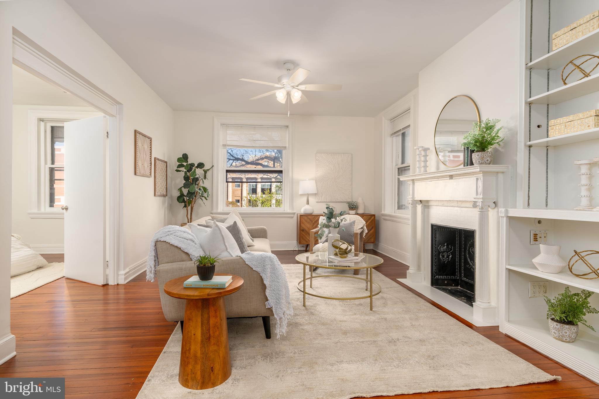 3060 16th Street Northwest, Unit 209 Washington, DC 20009 - Photo 5 of 33 a living room with furniture and a fireplace
