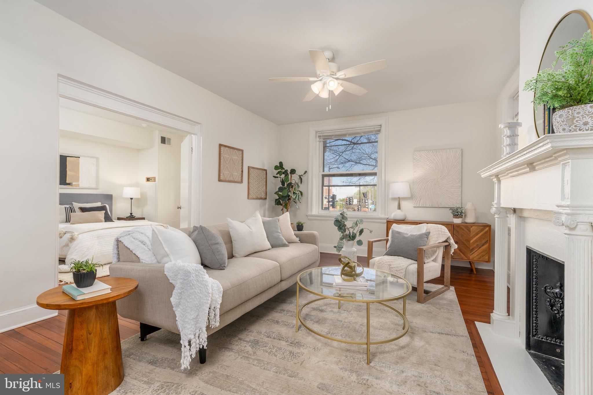 3060 16th Street Northwest, Unit 209 Washington, DC 20009 - Photo 6 of 33 a living room with furniture and a fireplace