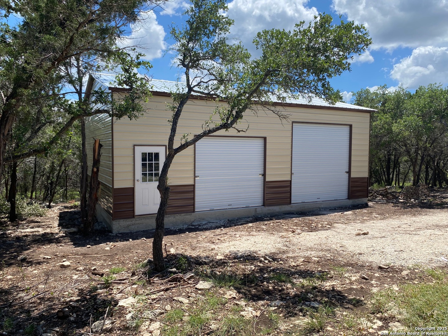 100 Sweet Clover Drive Spring Branch, TX 78070 - Photo 2 of 31 a house that has a tree in front of it