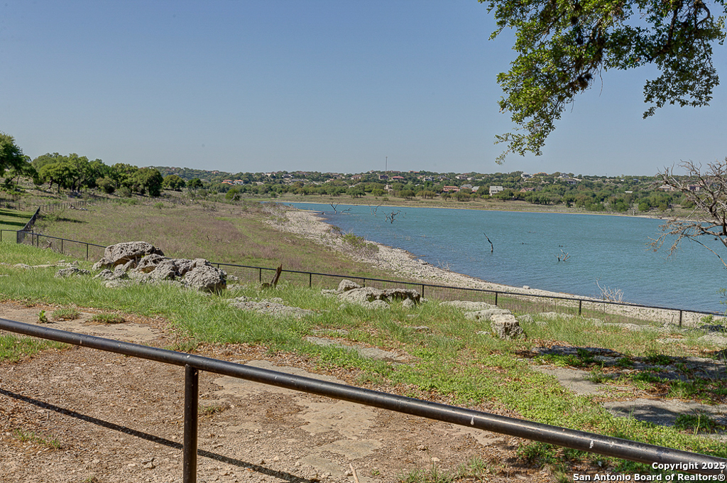 100 Sweet Clover Drive Spring Branch, TX 78070 - Photo 25 of 31 a view of a lake from a yard