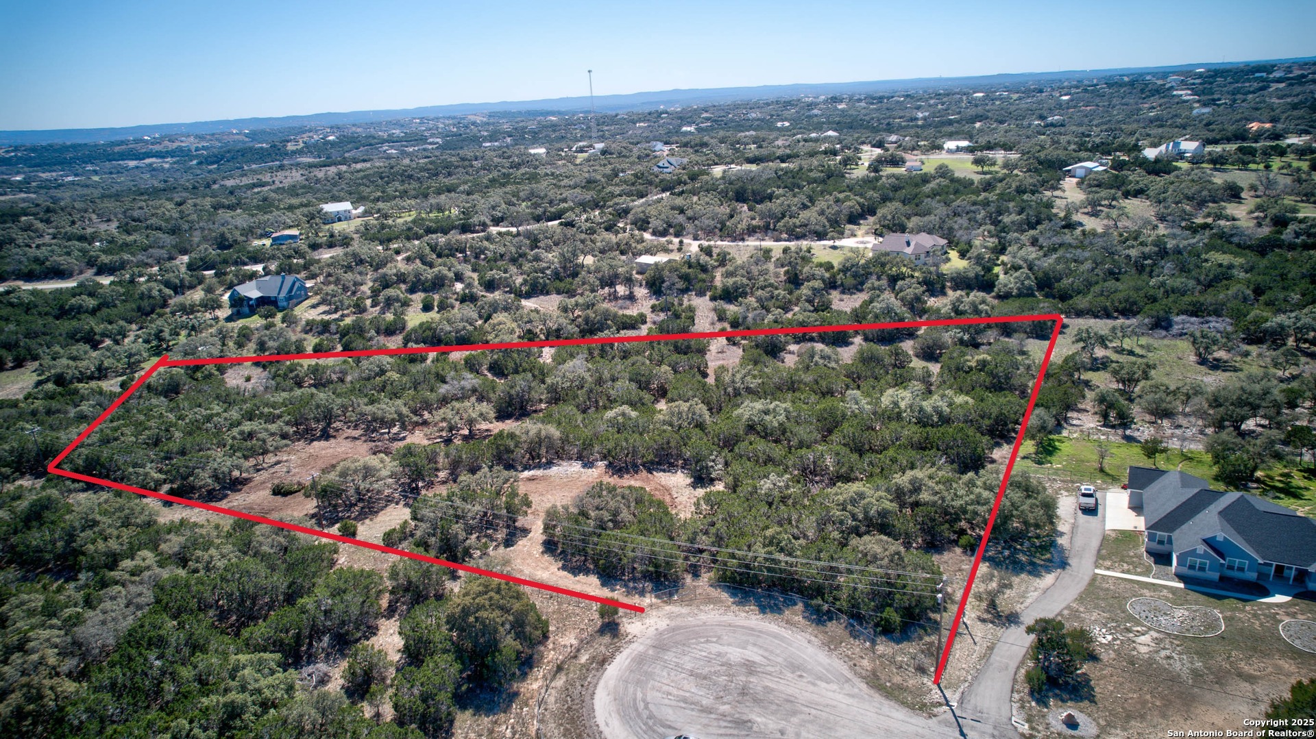 100 Sweet Clover Drive Spring Branch, TX 78070 - Photo 5 of 31 an aerial view of a houses with a street