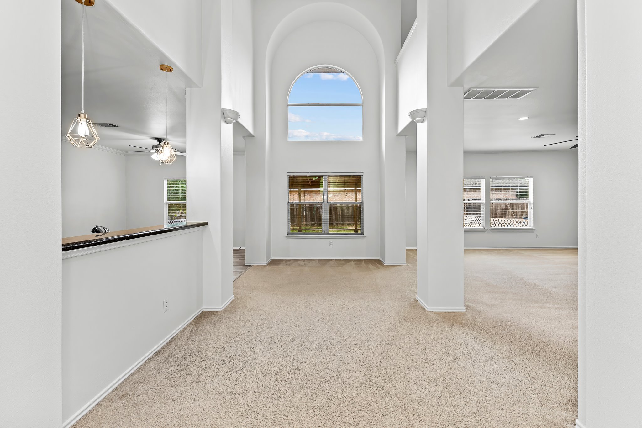 6700 Tulloch Way Austin, TX 78754 - Photo 2 of 39 an empty room with windows and cabinet