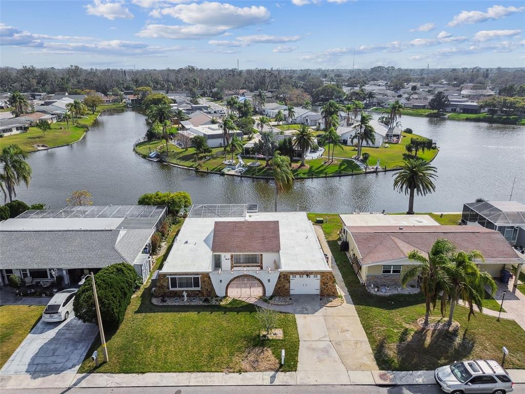 3248 Rock Valley Drive Holiday, FL 34691 - Photo 1 of 1 an aerial view of a house with swimming pool and ocean view