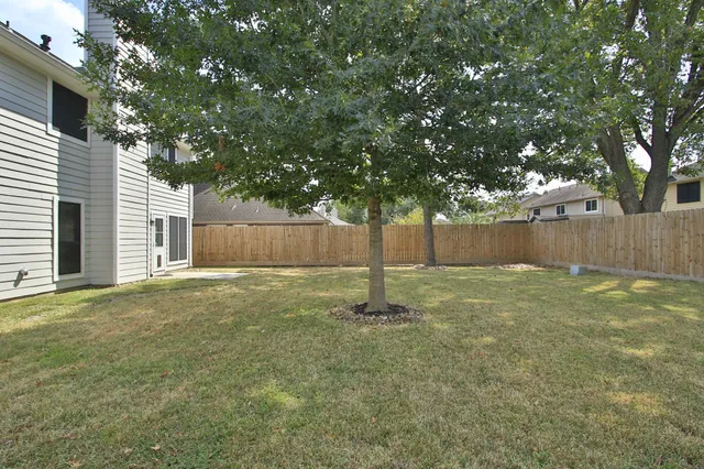 a house with a tree in the background