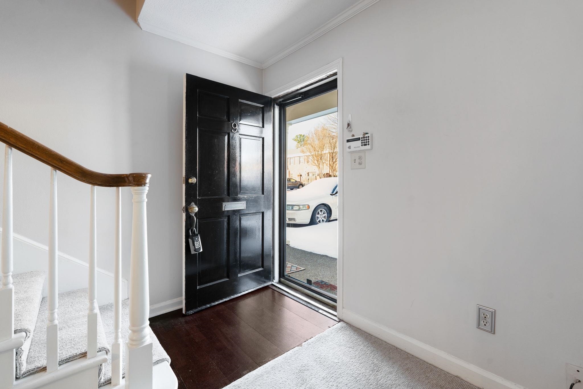 5726 Quince Road, Unit 9 Memphis, TN 38119 - Photo 5 of 21 Foyer entrance with ornamental molding and dark wood-type flooring