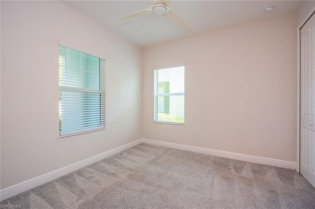 2409 Ariane Drive Naples, FL 34112 - Photo 12 of 16 an empty room with a window