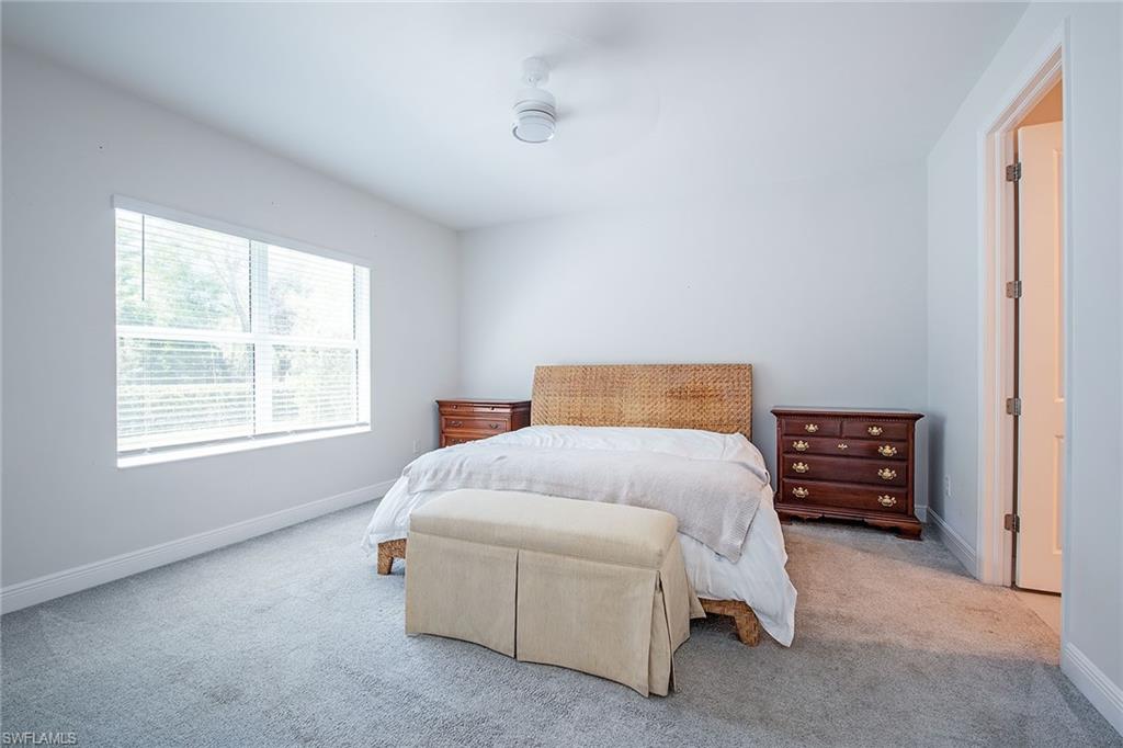 2409 Ariane Drive Naples, FL 34112 - Photo 15 of 16 a bedroom with a bed and a window