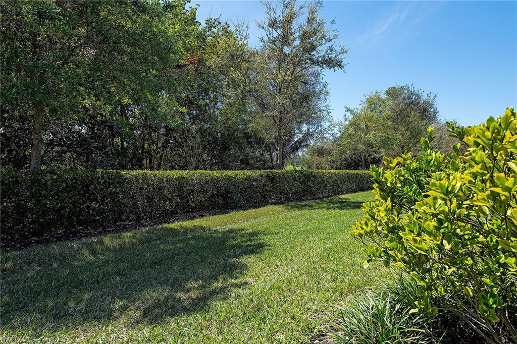 2409 Ariane Drive Naples, FL 34112 - Photo 3 of 16 a view of an outdoor space and a yard
