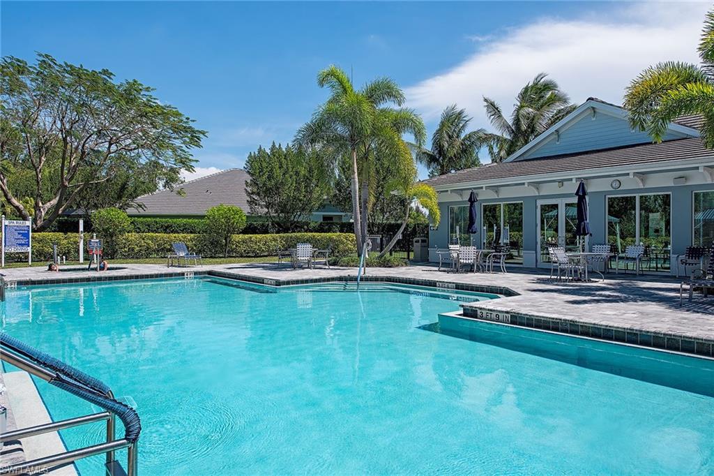 2409 Ariane Drive Naples, FL 34112 - Photo 4 of 16 a view of house with swimming pool and outdoor seating