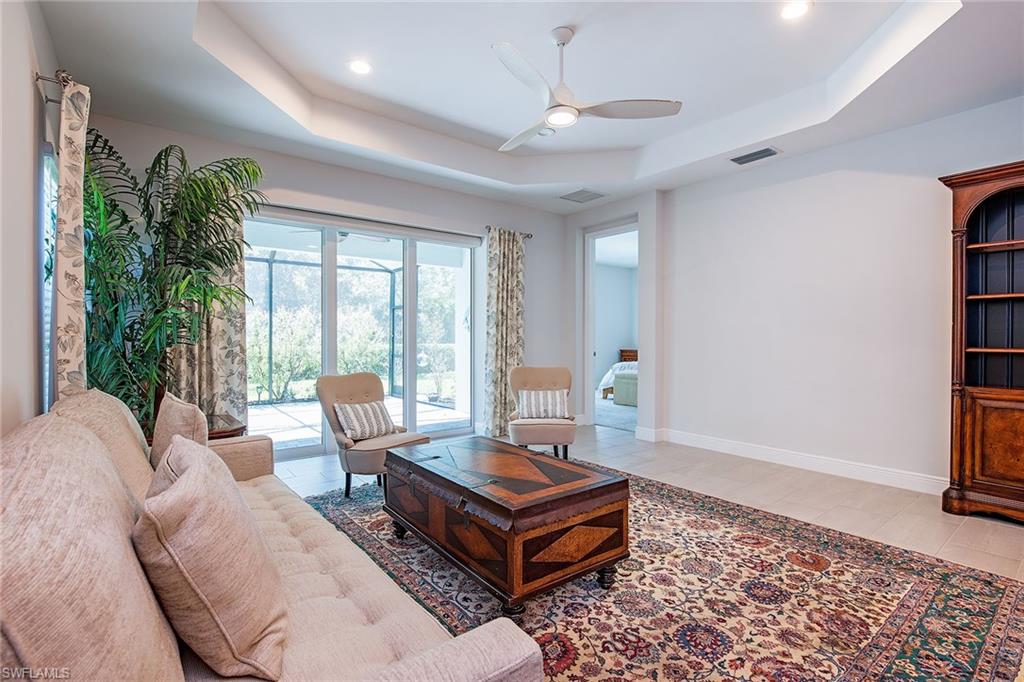 2409 Ariane Drive Naples, FL 34112 - Photo 5 of 16 a living room with furniture and a large window
