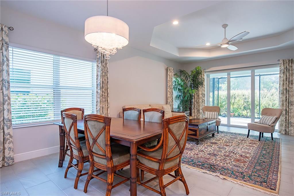 2409 Ariane Drive Naples, FL 34112 - Photo 9 of 16 a dining room with furniture and wooden floor