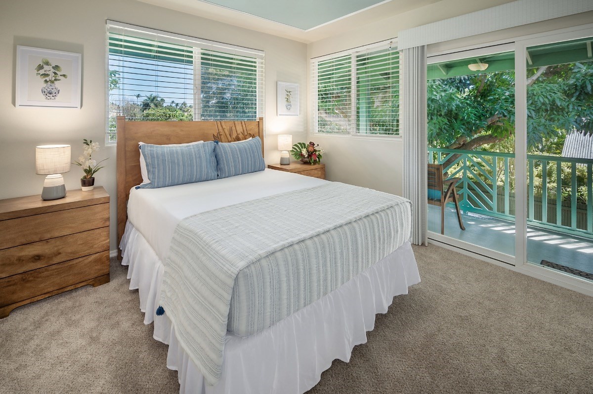 2258 Kuai Road Koloa, HI 96756 - Photo 13 of 30 a bedroom with a bed and a large window