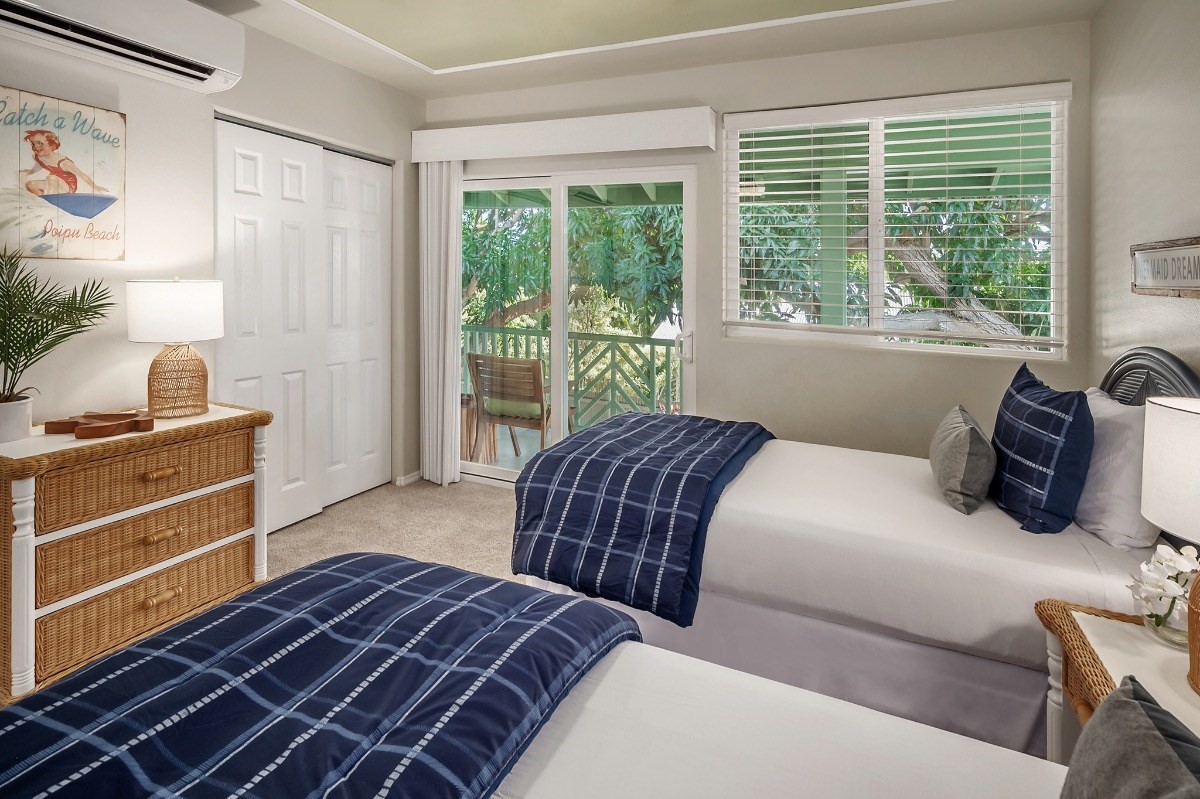2258 Kuai Road Koloa, HI 96756 - Photo 18 of 30 a bedroom with a bed and a window