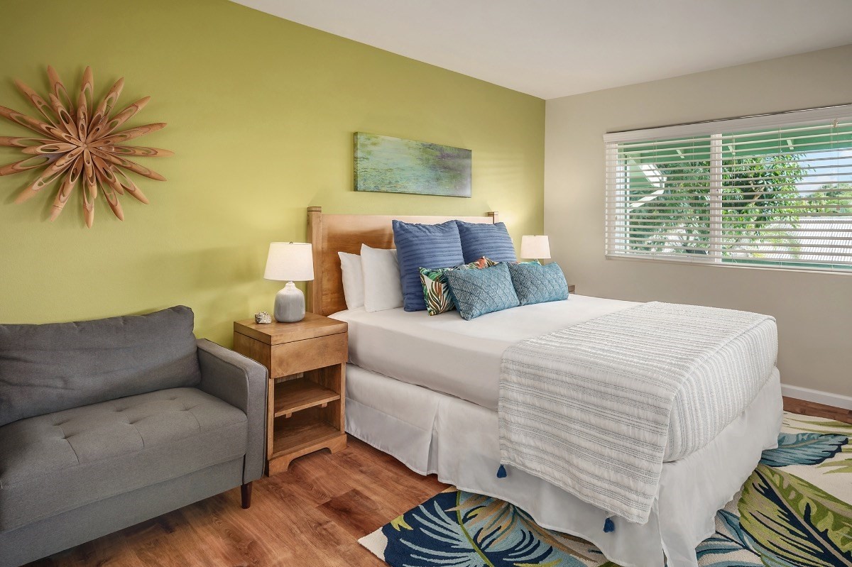 2258 Kuai Road Koloa, HI 96756 - Photo 22 of 30 a bedroom with a bed and a couch