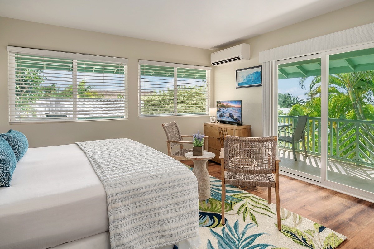 2258 Kuai Road Koloa, HI 96756 - Photo 23 of 30 a bed sitting in a bedroom next to a window