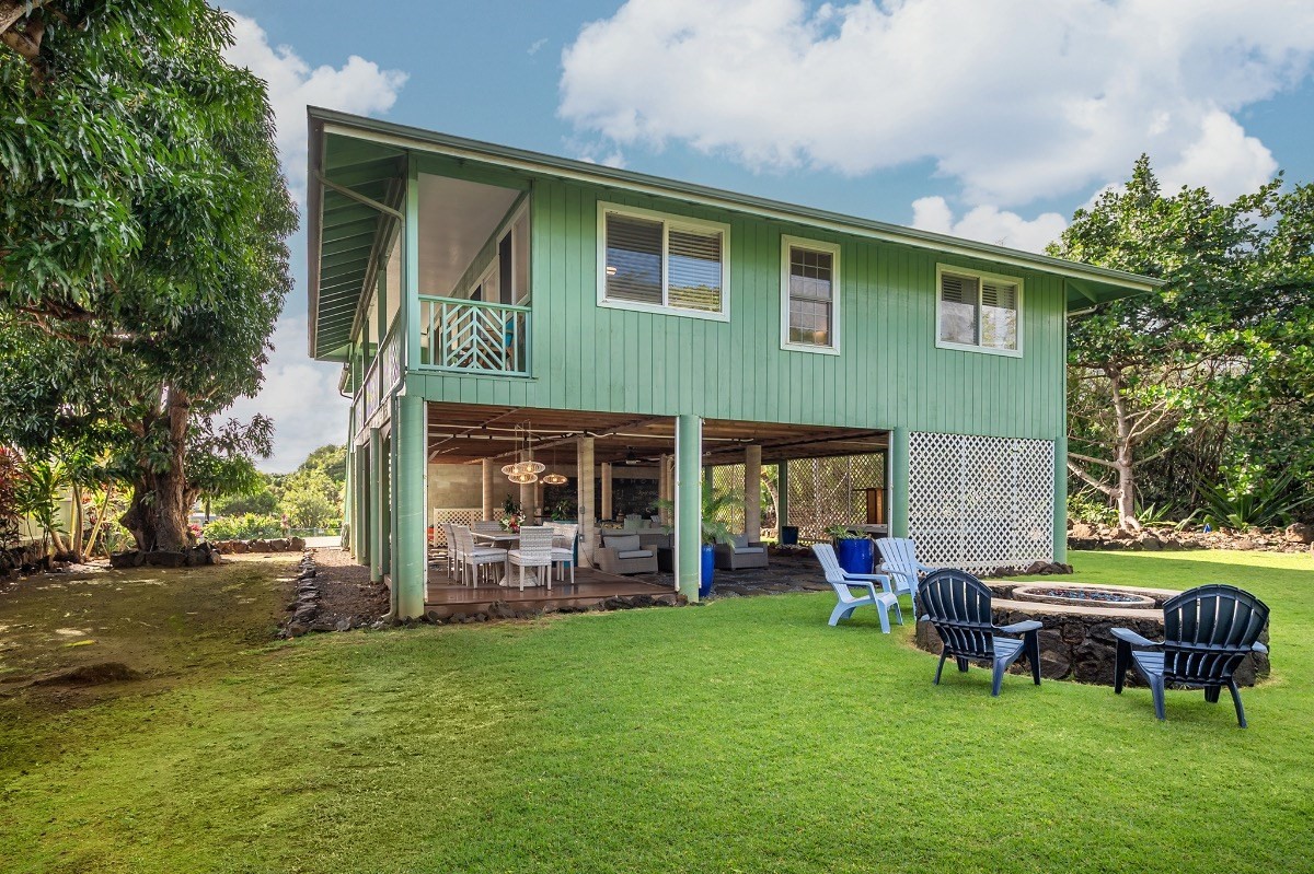 2258 Kuai Road Koloa, HI 96756 - Photo 26 of 30 a backyard of a house with yard and outdoor seating