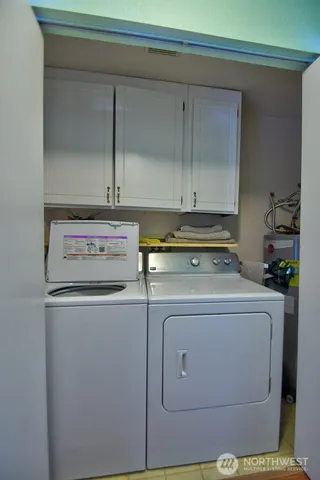 a utility room with washer and dryer