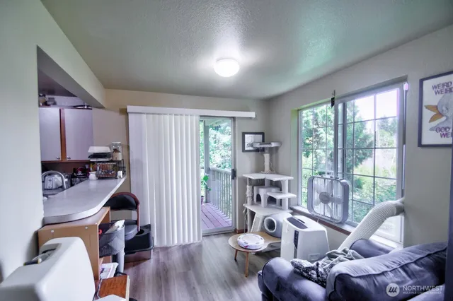 a view of a livingroom with furniture and a wooden floor