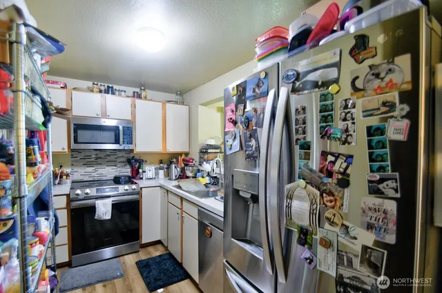 a kitchen with lots of different colored cloths