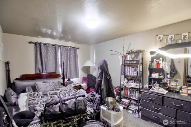 a bedroom with furniture and a bed