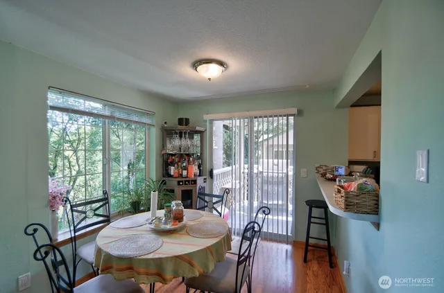 a view of a dining room with furniture window and wooden floor