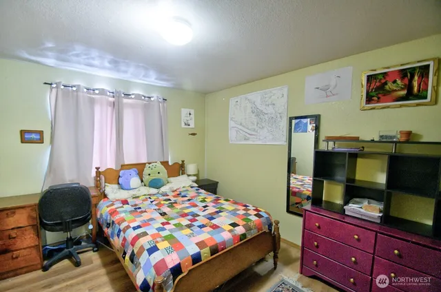 a bedroom with a bed and furniture