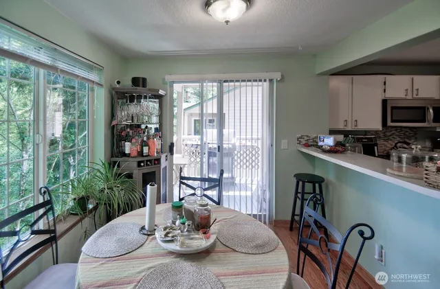 a view of a dining room with furniture window and outside view