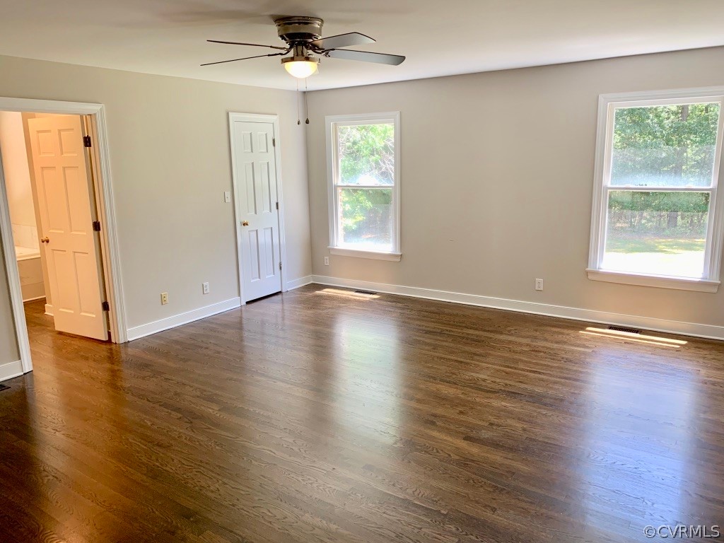8301 Cattail Road Chesterfield, VA 23838 - Photo 17 of 31 an empty room with wooden floor and windows