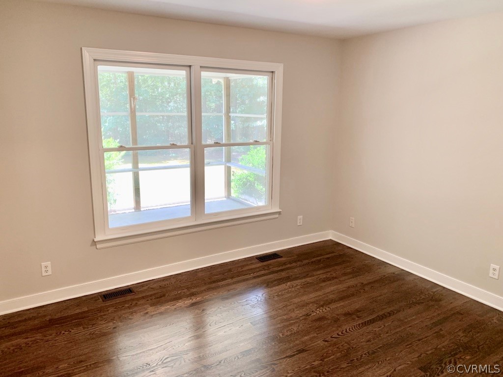 8301 Cattail Road Chesterfield, VA 23838 - Photo 23 of 31 an empty room with wooden floor and windows
