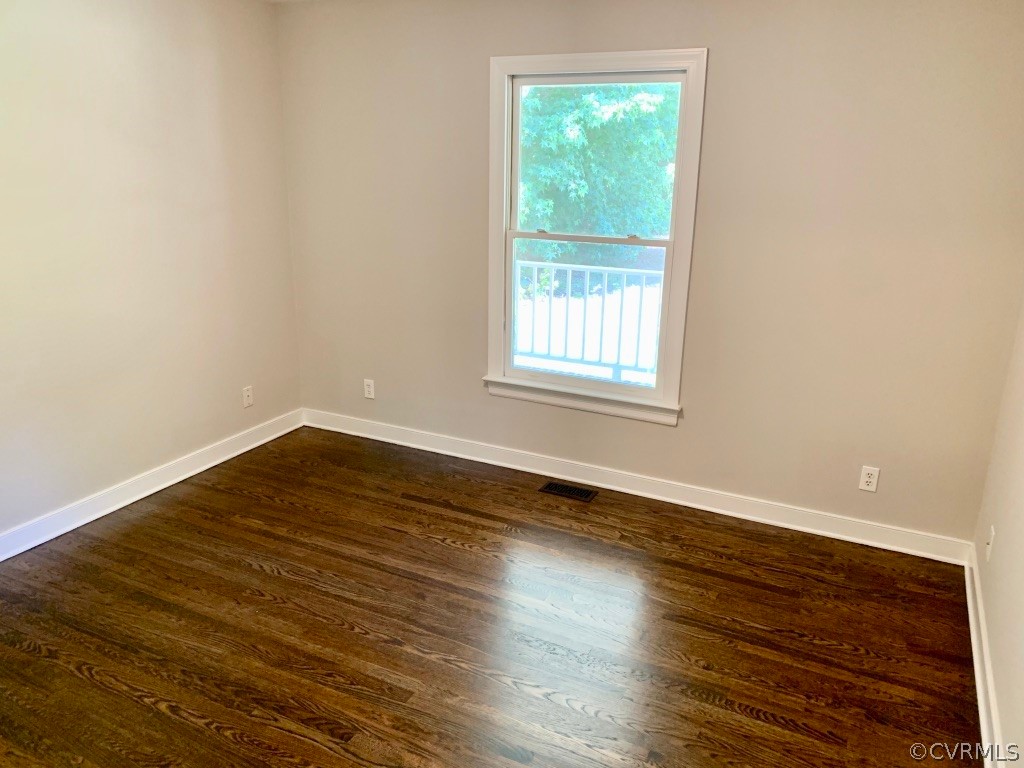 8301 Cattail Road Chesterfield, VA 23838 - Photo 24 of 31 an empty room with wooden floor and windows