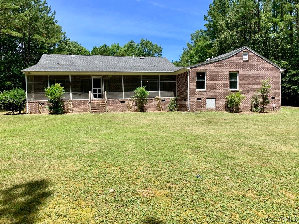 8301 Cattail Road Chesterfield, VA 23838 - Photo 28 of 31 a view of a house with a yard and sitting area