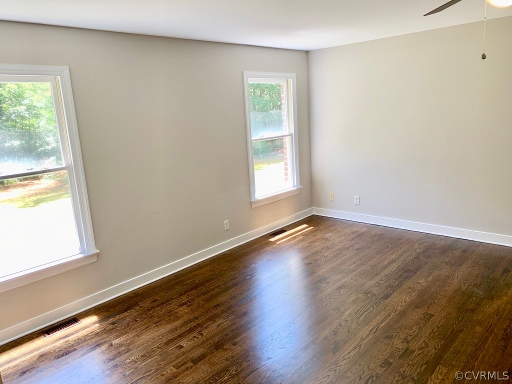 8301 Cattail Road Chesterfield, VA 23838 - Photo 5 of 31 a view of an empty room with wooden floor and a window