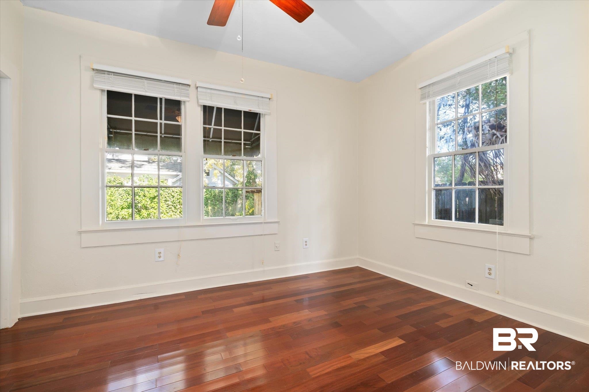 1220 Elmira Street Mobile, AL 36604 - Photo 8 of 20 Unfurnished room featuring ceiling fan and dark wood-type flooring