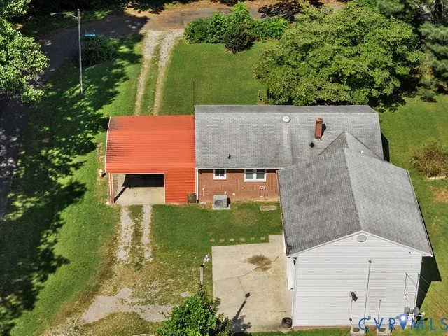 an aerial view of a house with a garden
