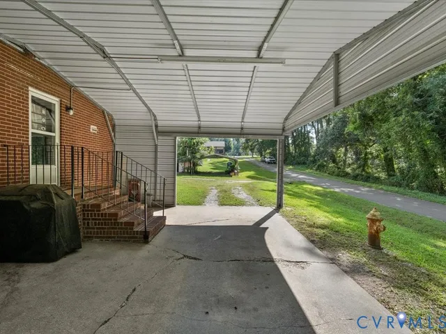 a view of a patio with couches chairs and potted plants