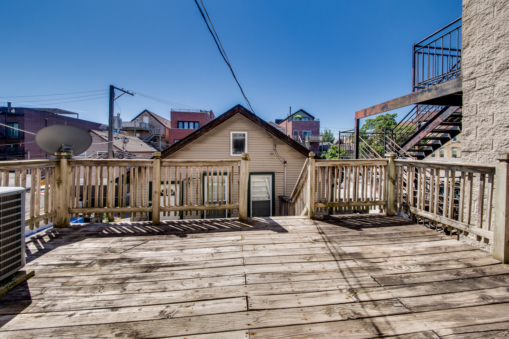 1246 North Cleaver Street, Unit 2R Chicago, IL 60642 - Photo 15 of 15 a view of a house with wooden deck