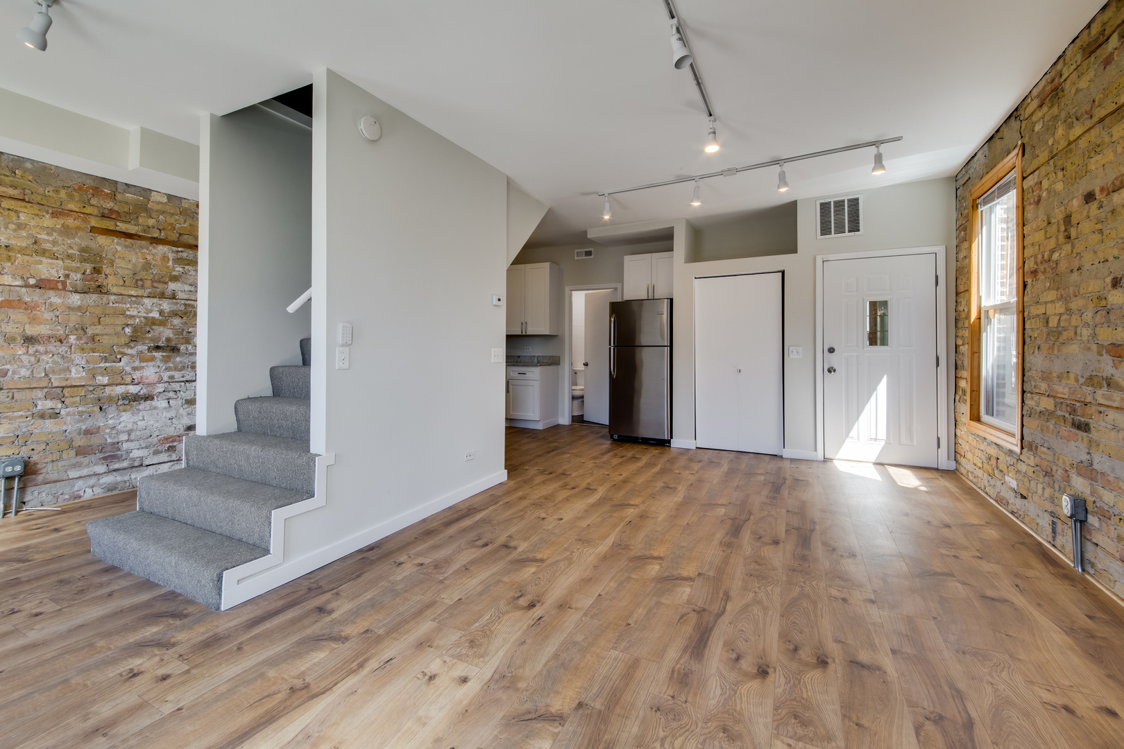 1246 North Cleaver Street, Unit 2R Chicago, IL 60642 - Photo 6 of 15 a view of an entryway with wooden floor