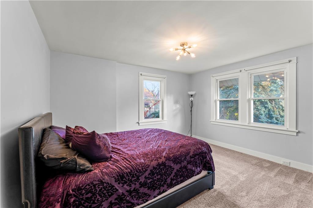 433 Green Street Homestead, PA 15120 - Photo 13 of 23 a bedroom with a bed and a window