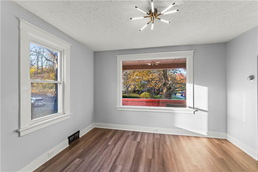 433 Green Street Homestead, PA 15120 - Photo 14 of 33 a view of an empty room with a window and wooden floor