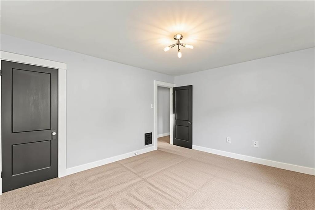 433 Green Street Homestead, PA 15120 - Photo 18 of 33 an empty room with closet and chandelier fan