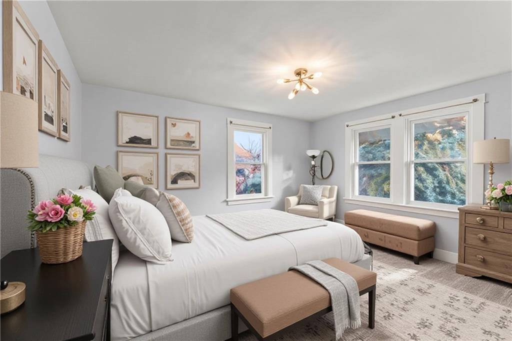 433 Green Street Homestead, PA 15120 - Photo 19 of 33 a spacious bedroom with a bed and a chandelier