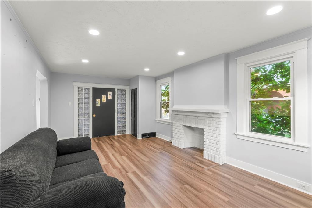 433 Green Street Homestead, PA 15120 - Photo 5 of 23 a living room with furniture and a fireplace