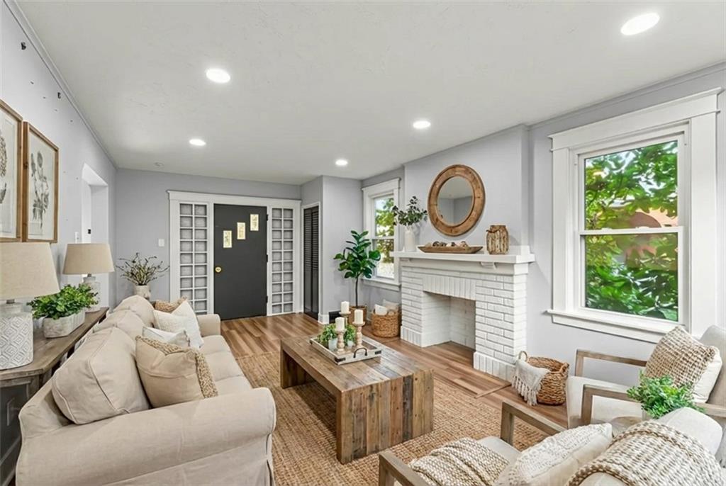 433 Green Street Homestead, PA 15120 - Photo 5 of 33 a living room with furniture a fireplace and a large window